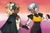Size: 1021x672 | Tagged: safe, artist:nellyartz, tangle the lemur, whisper the wolf, human, 2023, dark skin, duo, heart, holding hands, humanized, lesbian, lesbian pride, looking at them, pride, pride flag background, redraw, shipping, smile, tangle x whisper, vitiligo