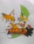 Size: 1604x2048 | Tagged: safe, artist:transgender-battlekukku, miles "tails" prower, speedy, bird, fox, sonic adventure 2, duo, english text, eyelashes, kukku, logo, looking at viewer, male, posing, smile, traditional media