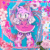 Size: 500x500 | Tagged: safe, artist:aleespace-art, amy rose, hedgehog, 2025, abstract background, animated, bow, candy, character name, flat colors, flower, food, gif, heart, lollipop, looking at viewer, mouth open, smile, solo, standing, star (symbol), text