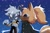 Size: 2048x1367 | Tagged: safe, artist:cawffeejelly, tangle the lemur, whisper the wolf, lemur, wolf, 2025, abstract background, blushing, cute, duo, female, heart, kiss, lesbian, nighttime, outdoors, shipping, smile, sparkles, standing, tangle x whisper, wagging tail, whispabetes
