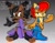 Size: 3850x2975 | Tagged: safe, artist:unhinged_honey, nicole the hololynx, sally acorn, chipmunk, lynx, squirrel, character name, devil horns (gesture), duo, female, gradient background, holding something, hololynx, signature, uekawa style