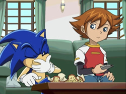 Size: 995x750 | Tagged: safe, chris thorndyke, sonic the hedgehog, hedgehog, human, confused, couch, duo, eating, food, male, screencap, sitting, sofa, sonic x, table, tv remote