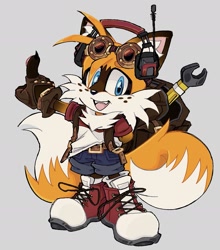 Size: 1341x1522 | Tagged: safe, artist:thenameislillyd, miles "tails" prower, fox, 2025, backpack, belt, brown gloves, chest fluff, claws, clothes, ear fluff, eyewear on head, fangs, freckles, fur markings, gloves, goggles, goggles on head, grey background, headphones, headset, mouth open, open smile, redesign, redraw, shirt, shoelaces, shoes, shorts, simple background, smile, solo, standing, wrench
