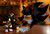 Size: 1280x863 | Tagged: safe, artist:demonhedgehog, shadow the hedgehog, 2017, christmas, christmas tree, frown, head rest, lidded eyes, looking at viewer, photographic background, shadow is not amused, solo, table, unamused