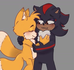 Size: 1675x1593 | Tagged: safe, artist:dxnnmint, miles "tails" prower, shadow the hedgehog, 2025, blushing, cute, duo, eyes closed, gay, gloves off, grey background, hugging, looking at them, shadow x tails, shadowbetes, shipping, simple background, smile, standing, tailabetes