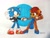 Size: 1599x1201 | Tagged: safe, artist:sebas289377, sally acorn, sonic the hedgehog, chipmunk, hedgehog, 2025, alternate outfit, clothes, dancing, dress, duo, female, grin, happy, holding hands, looking at viewer, male, open smile, sally x sonic, shipping, simple background, smile, smiling at each other, straight, suit, traditional media, wink