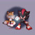 Size: 1748x1748 | Tagged: safe, artist:starrygirlypop, miles "tails" prower, shadow the hedgehog, fox, hedgehog, 2026, chaos emerald, double v sign, duo, frown, gradient background, holding something, looking at viewer, looking offscreen, male, mouth open, open smile, posing, redraw, shadow the hedgehog (video game), signature, smile, smiling at viewer, v sign, victory pose