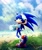 Size: 1710x2048 | Tagged: safe, artist:inksnouts, sonic the hedgehog, hedgehog, 2026, abstract background, beach, clouds, crepuscular rays, crop top, daytime, flower, grass, grass blade, hand on head, lidded eyes, lineless, looking at viewer, male, ocean, outdoors, plant, sand, smile, smiling at viewer, solo, standing, standing on one leg, treads, water