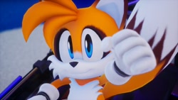 Size: 1920x1080 | Tagged: safe, artist:tailbiscuits, miles "tails" prower, 2026, 3d, clenched fist, fur markings, looking at viewer, redesign, screencap, smile, solo, sonic racing crossworlds