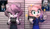 Size: 1280x735 | Tagged: safe, artist:cinnaluu, amy rose, blaze the cat, cat, hedgehog, amy x blaze, barbie movie, barbie mugshot meme, cosplay, enid sinclair, female, lesbian, meme, mugshot, shipping, skirt, the addams family, wednesday (series), wednesday addams